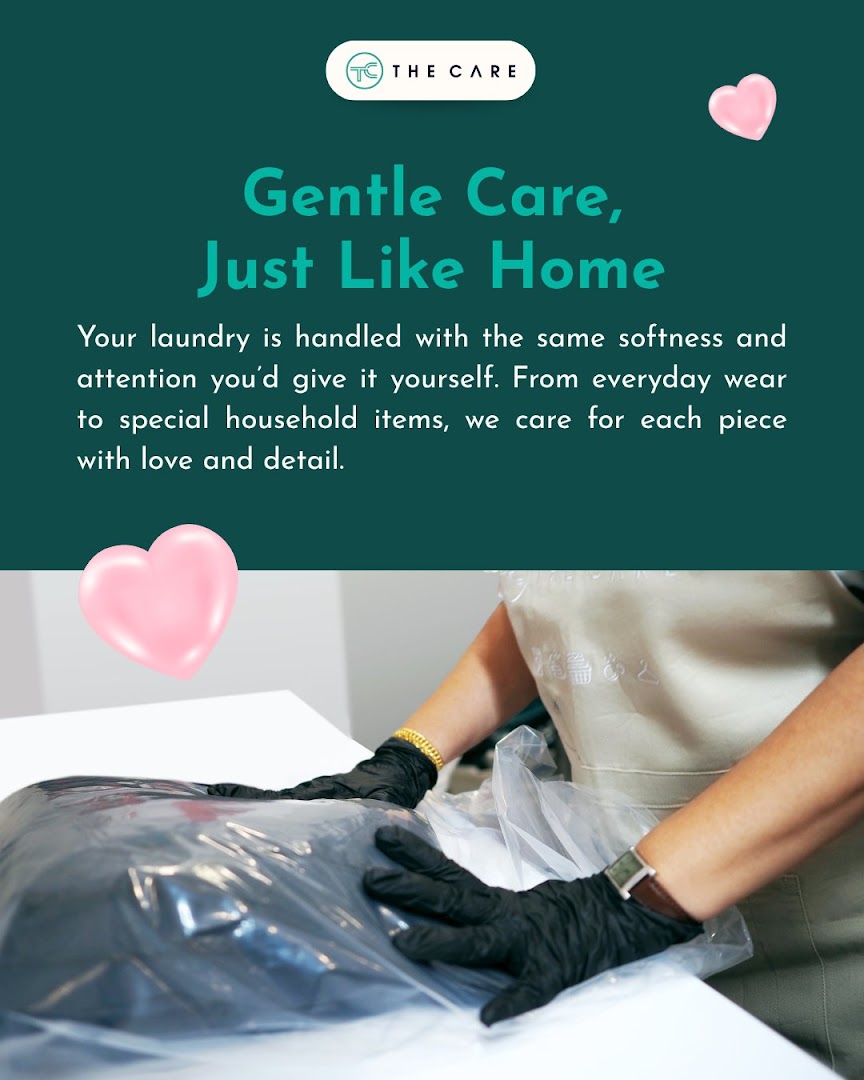 An employee carefully bags laundered items, emphasizing the shop's gentle and detailed laundry care service.
