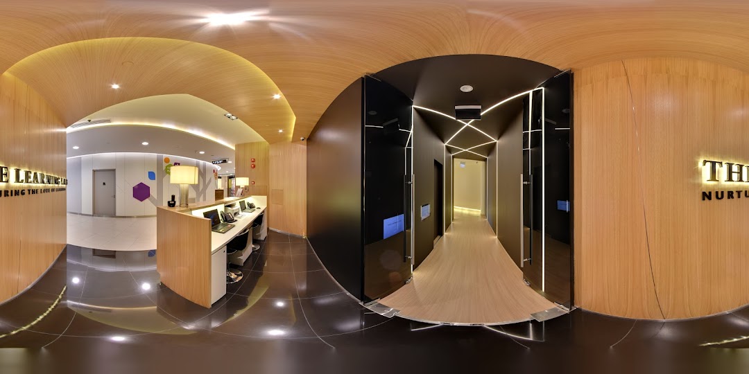 A modern and inviting interior view of The Learning Lab's reception area and hallway.