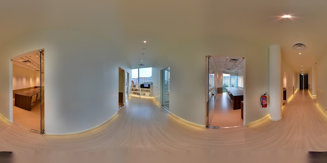 A bright, modern interior hallway of The Learning Lab with classrooms and study areas.