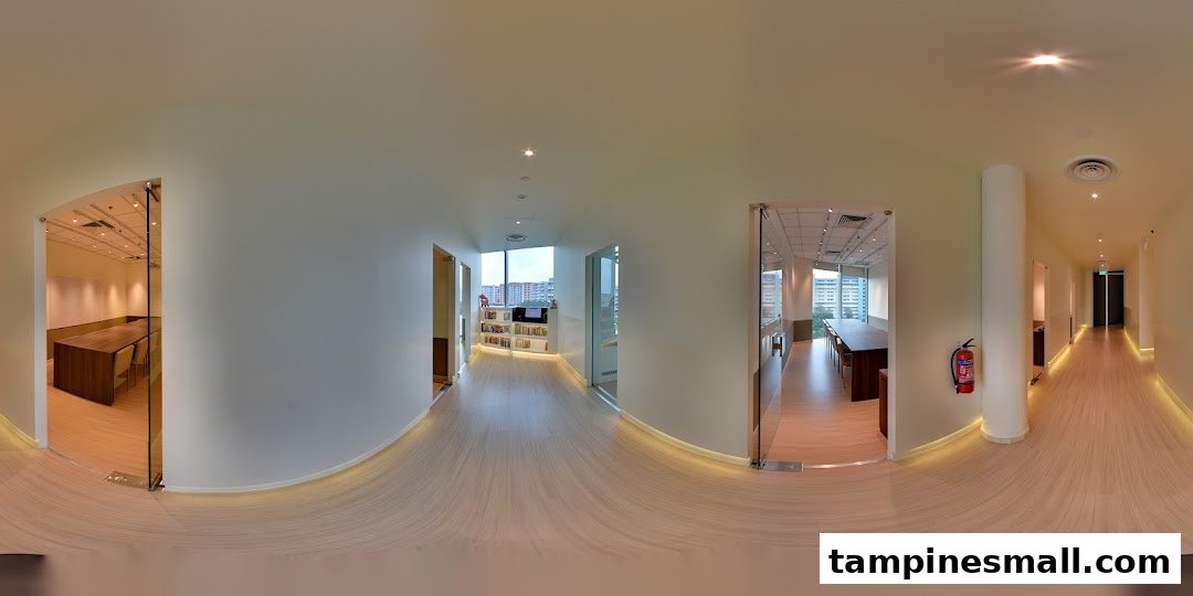 A bright, modern interior hallway of The Learning Lab with classrooms and study areas.