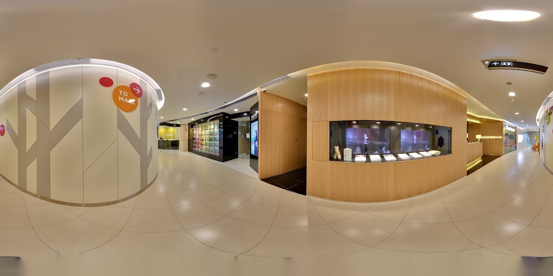 Interior view of The Learning Lab, featuring a reception area, display cases, and a bright, modern hallway.