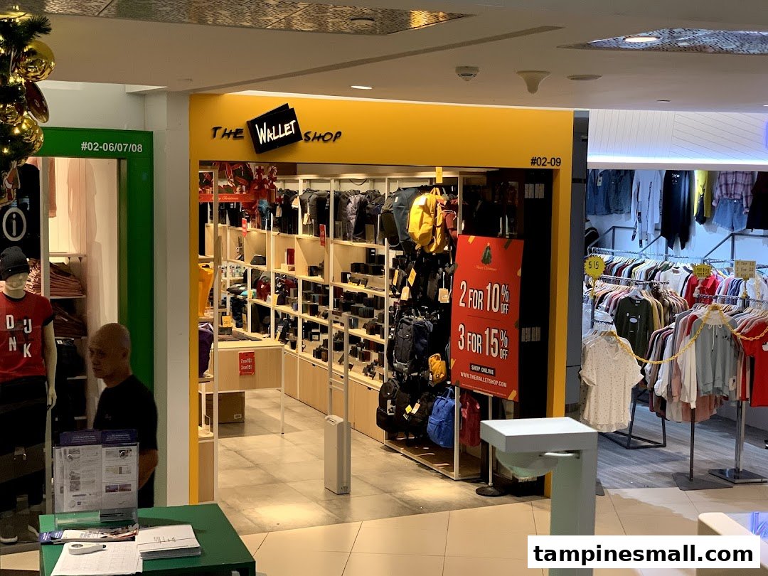The shop front of The Wallet Shop, featuring wallets, bags, and promotional offers.
