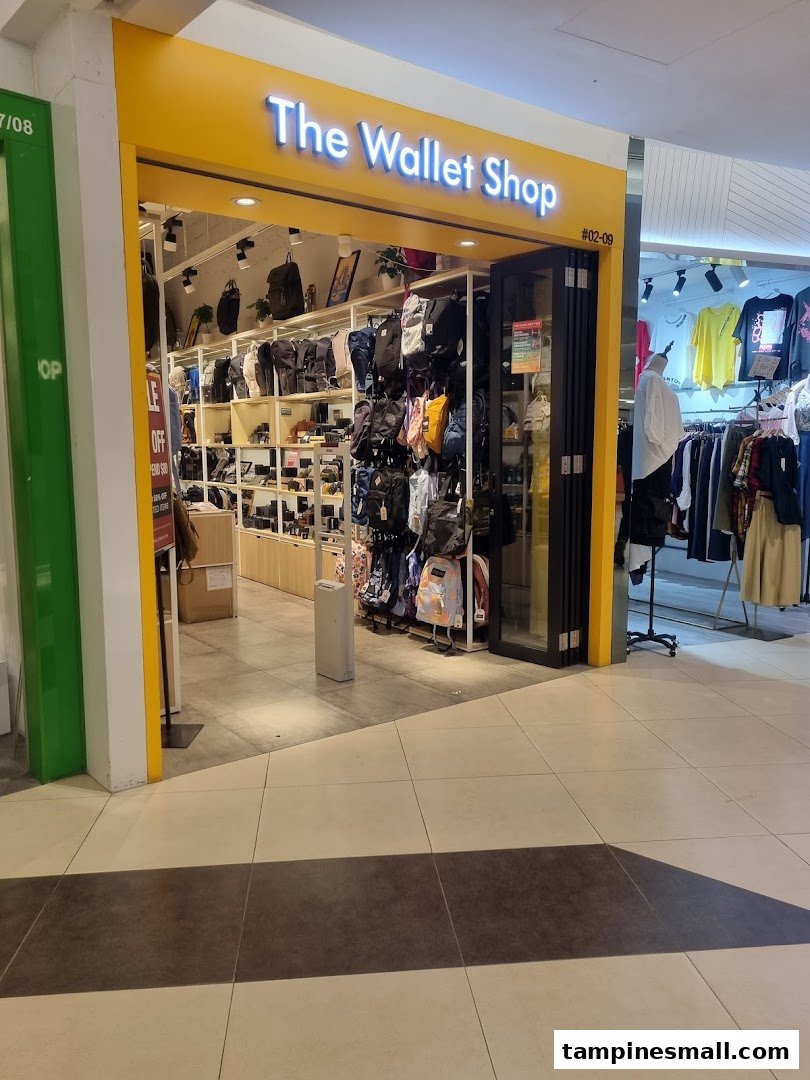 The brightly lit entrance of The Wallet Shop, showcasing a wide array of bags and wallets inside.