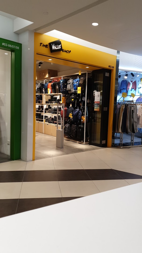 The shopfront of 'The Wallet Shop' showcasing a wide array of wallets, bags, and accessories.