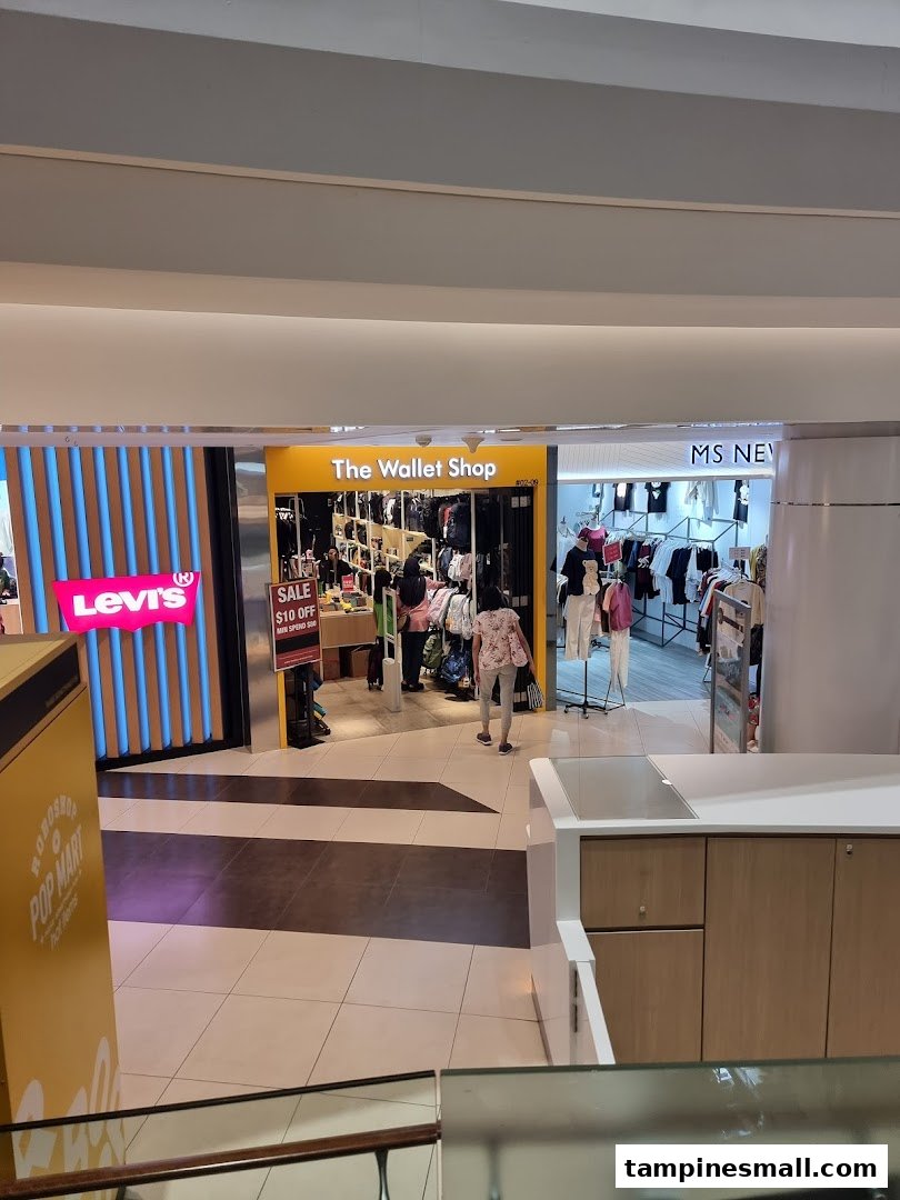 View of The Wallet Shop entrance, showcasing a wide array of wallets and accessories inside.