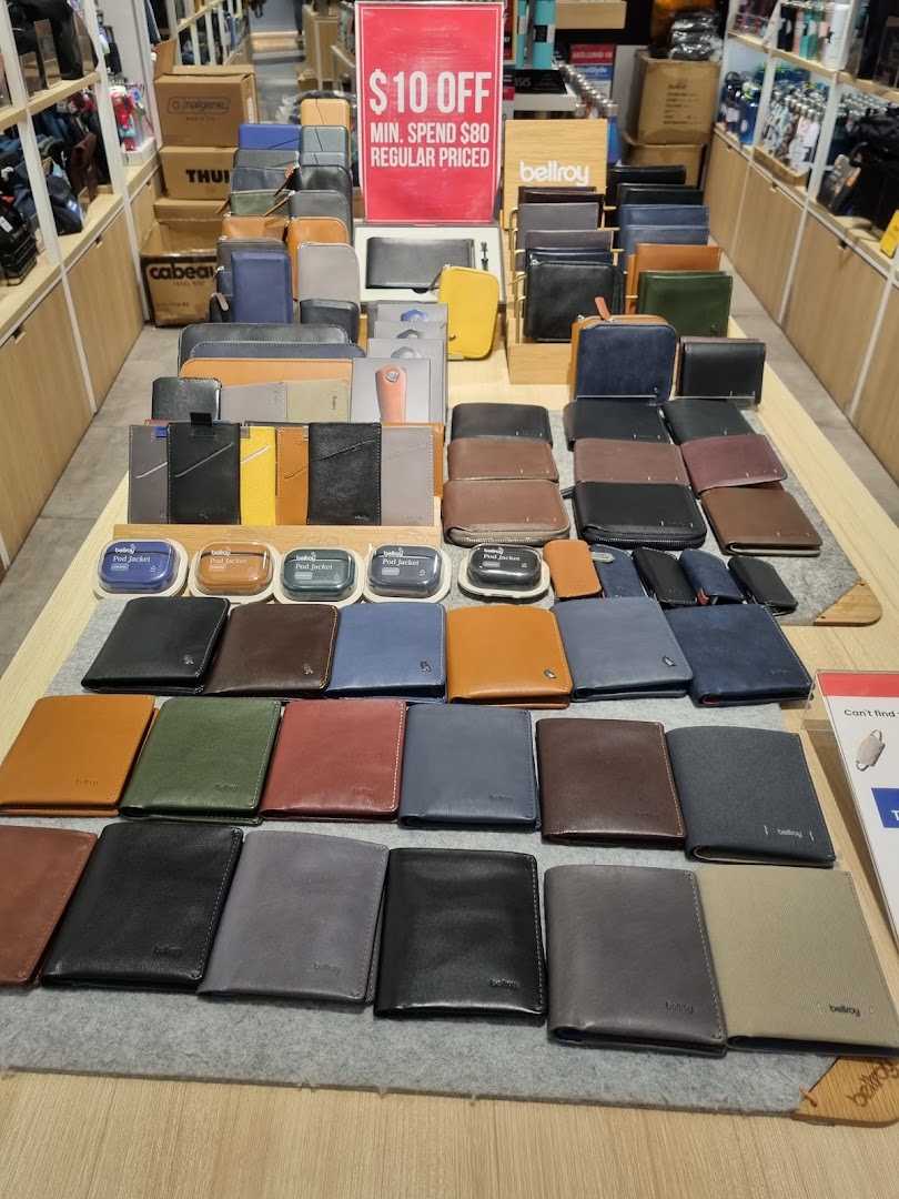 A vibrant display of various Bellroy wallets and accessories in different colors and styles.