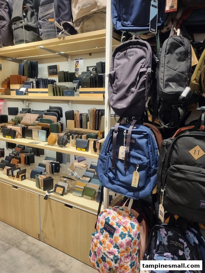 Interior view of The Wallet Shop showcasing a wide selection of wallets, bags, and backpacks on display.