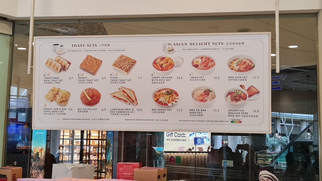 A comprehensive menu board displaying Toast Box's Toast Sets and Asian Delight Sets with prices.