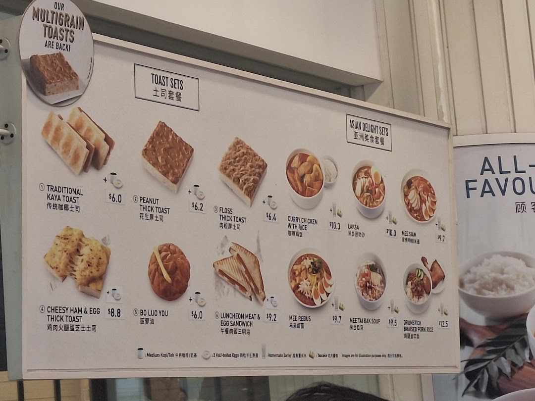 A detailed menu board displaying Toast Box's toast sets and Asian delight sets with prices.