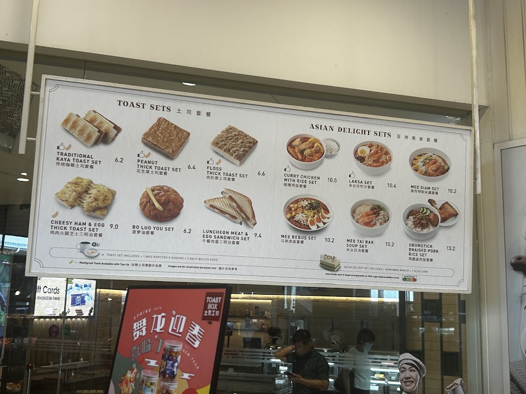 A comprehensive menu board displaying Toast Box's toast sets and Asian delight sets with prices.
