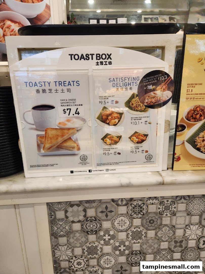 A menu display board showcasing Toast Box's 'Toasty Treats' and 'Satisfying Delights' offerings.