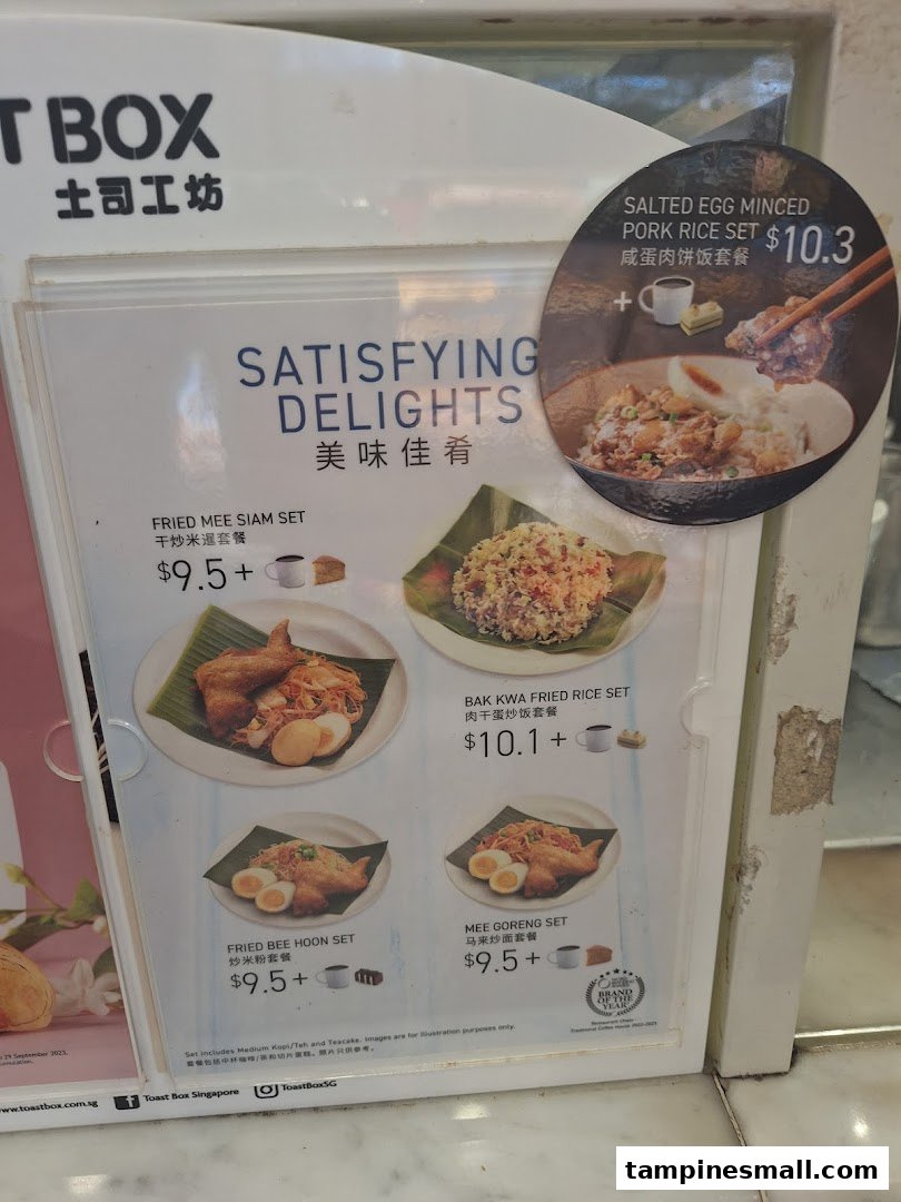 A menu board displaying various set meals with prices and images from Toast Box.