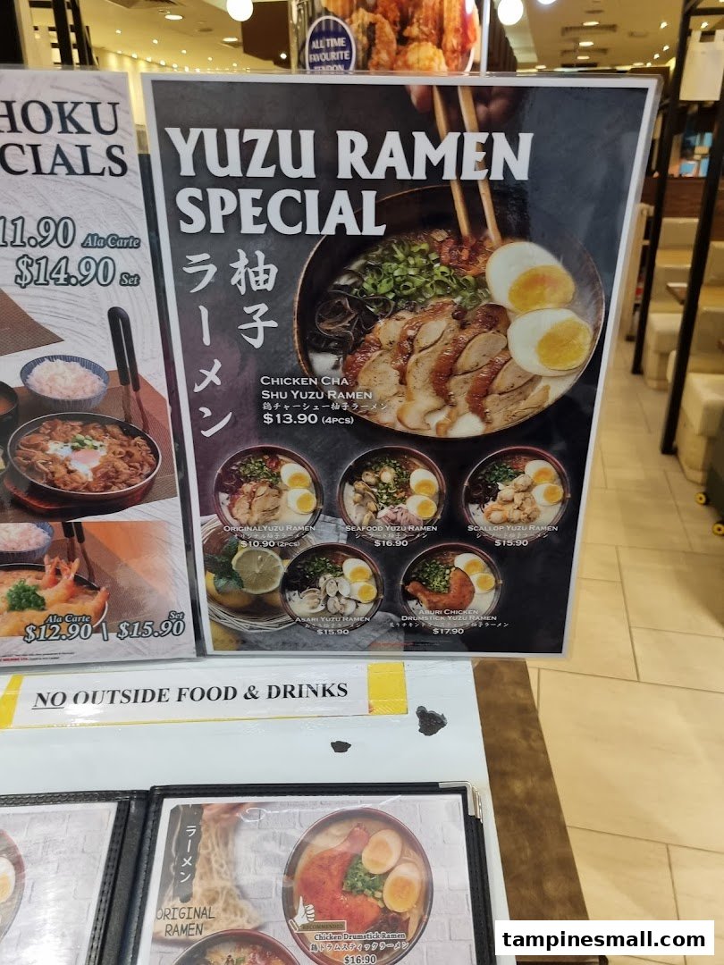 A vibrant menu display showcasing Yuzu Ramen specials and other Japanese dishes with prices.