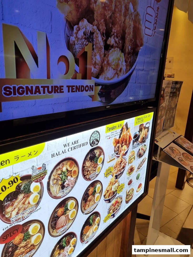 Digital menu boards displaying a variety of Halal Japanese ramen and tendon dishes with prices.