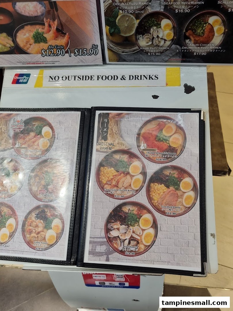 A detailed menu display showcasing various ramen dishes and other Japanese meals with prices.