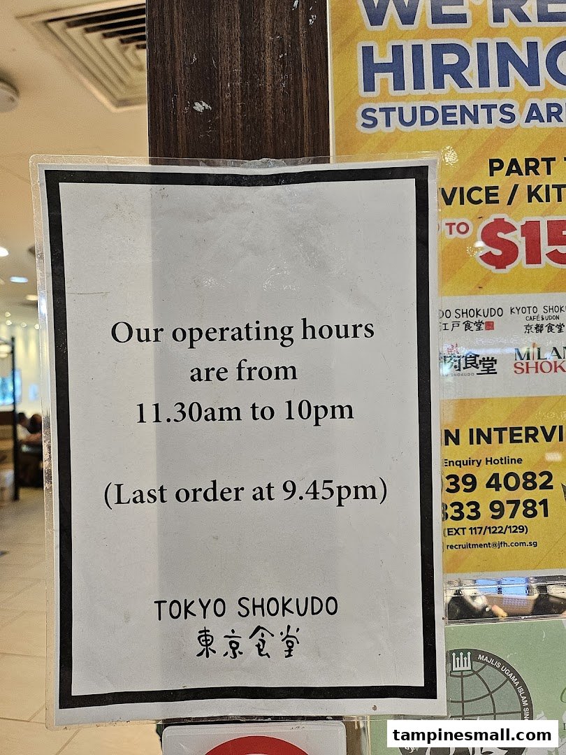A sign displaying Tokyo Shokudo's operating hours and last order time.