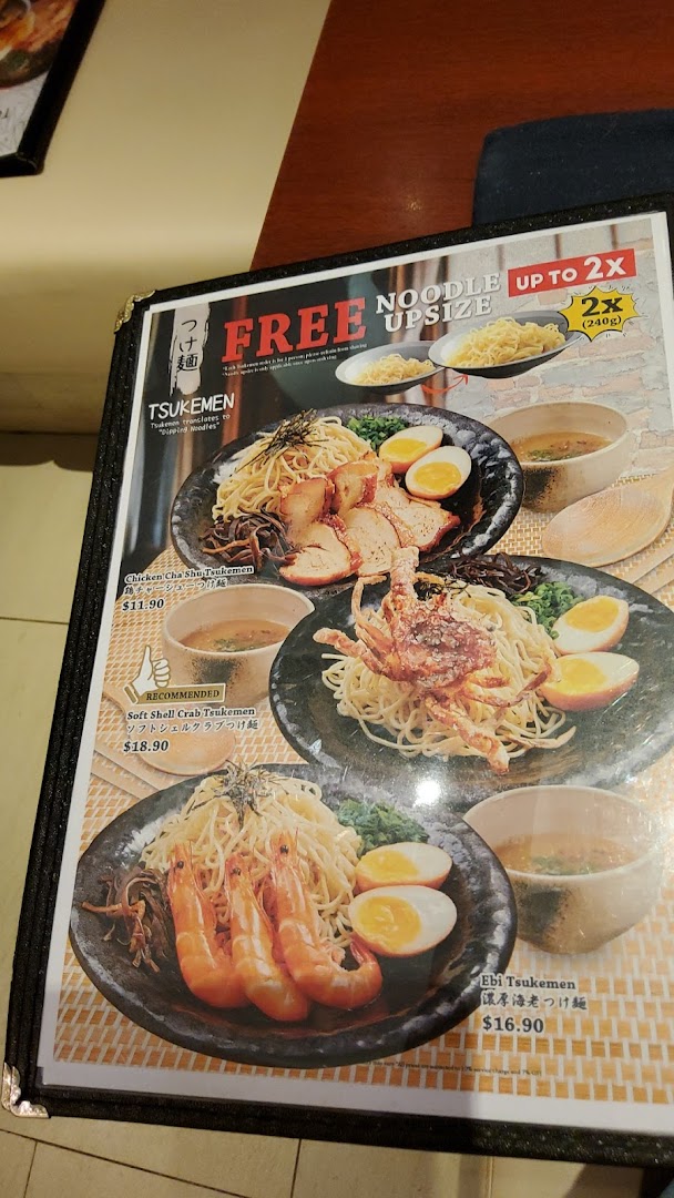 A close-up of a menu page featuring various Tsukemen (dipping noodles) dishes with images and prices.