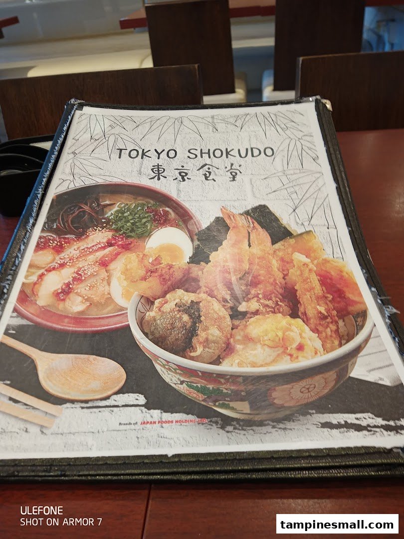 A menu cover for Tokyo Shokudo featuring vibrant images of ramen and tempura dishes.
