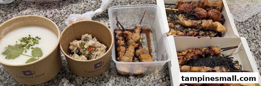 A collection of takeout dishes, including congee, a savory meat dish, and various grilled skewers, on a countertop.