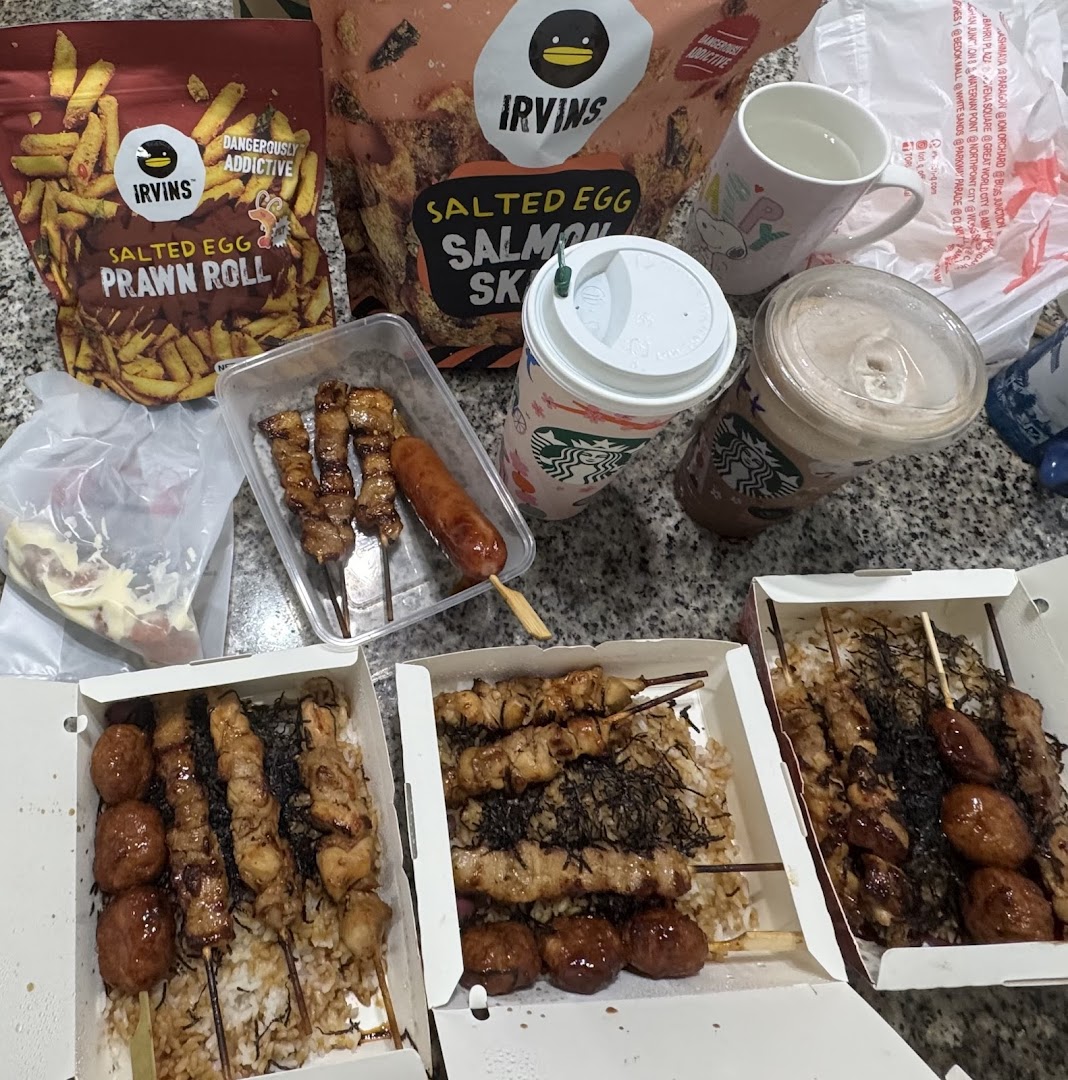 A spread of delicious skewers, rice bowls, salted egg snacks, and beverages from TORI-Q.