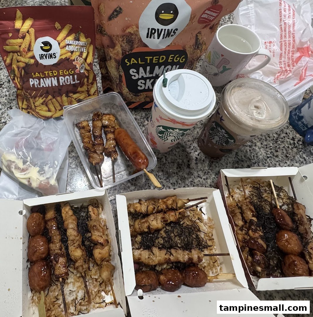 A spread of delicious skewers, rice bowls, salted egg snacks, and beverages from TORI-Q.