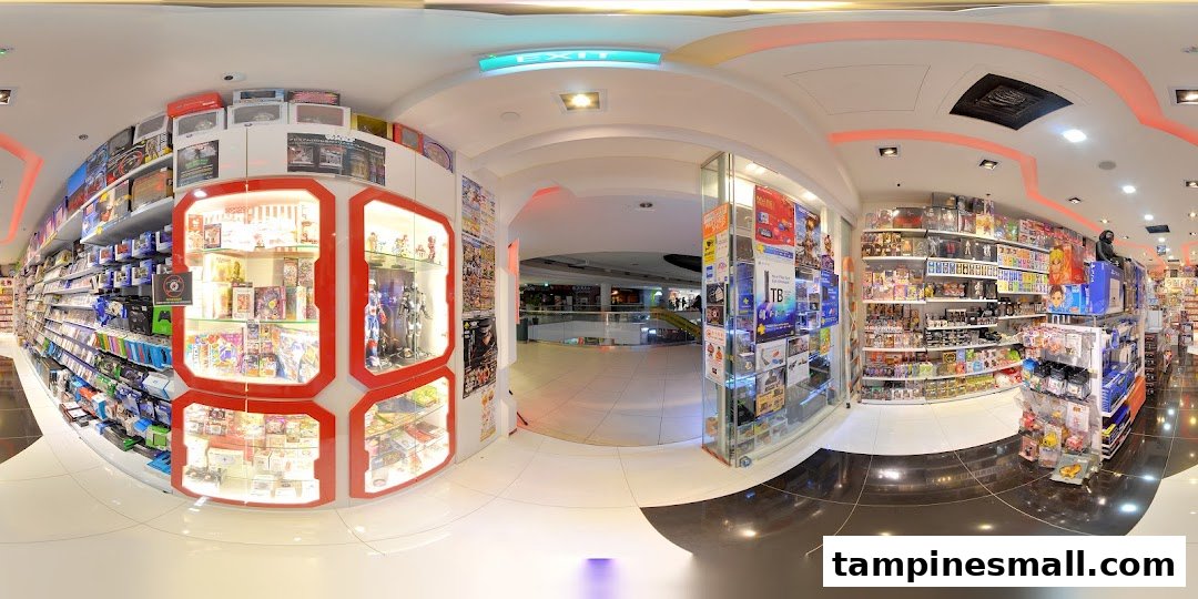 A wide-angle view of the 'Toy Or Game' shop entrance, showcasing product displays and the mall beyond.