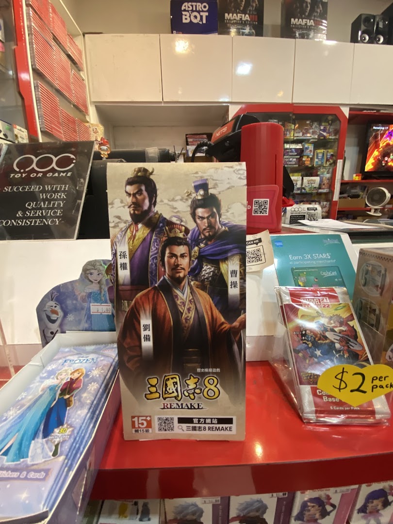 An interior shot of Toy Or Game, showcasing video games, trading cards, and collectibles.