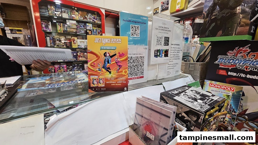 A vibrant retail shop counter displaying video games, card games, and promotional materials for new releases.