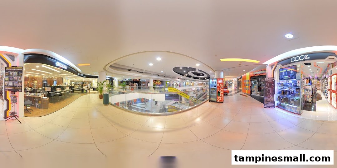 A panoramic view of a brightly lit mall corridor featuring the 'Toy Or Game' shop entrance.