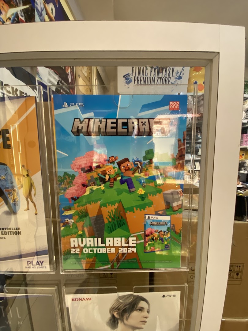 A display case featuring a 'Minecraft' PS5 game poster with an availability date.