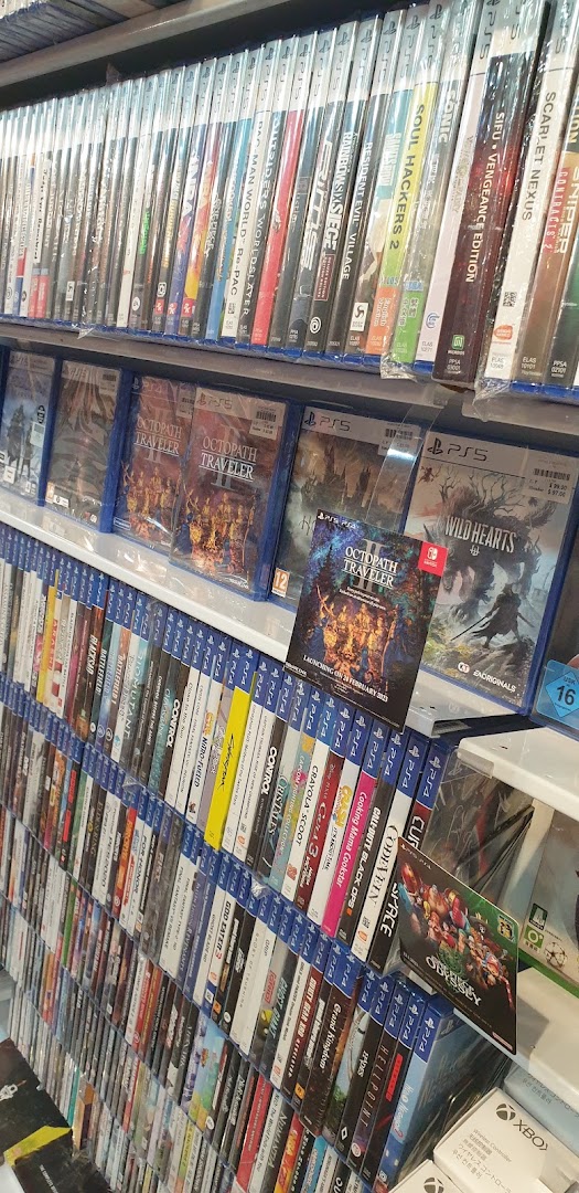 Shelves filled with a wide selection of video game titles for various consoles, including PS4 and PS5.