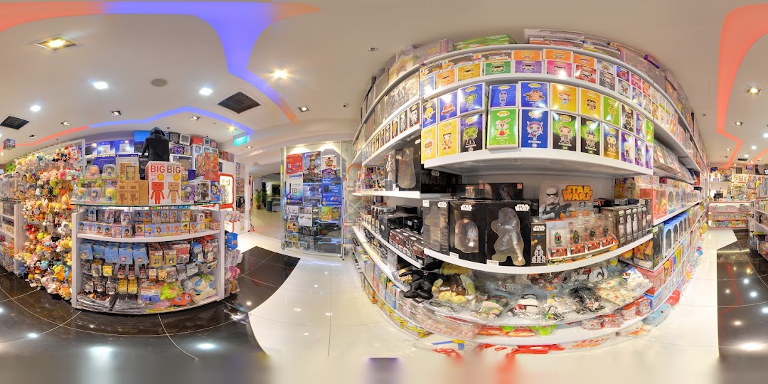 A vibrant interior view of a toy and game shop, showcasing shelves filled with collectibles, plush toys, and action figures.