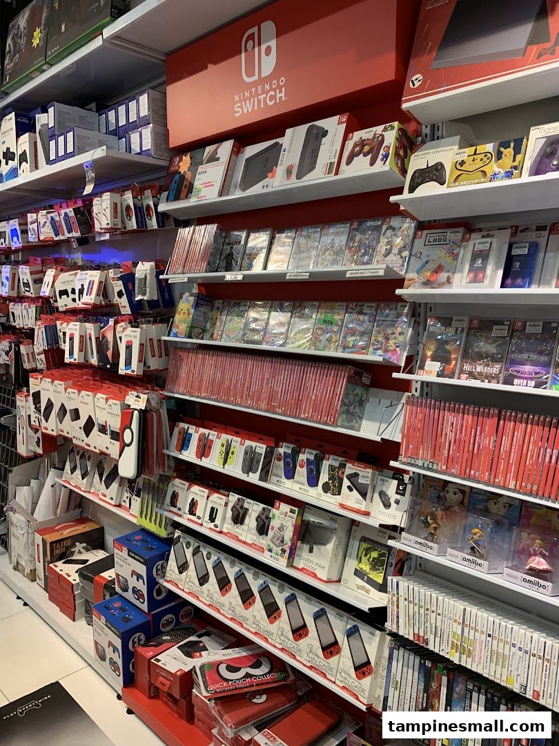 Shelves packed with Nintendo Switch consoles, games, and accessories in a vibrant retail store.