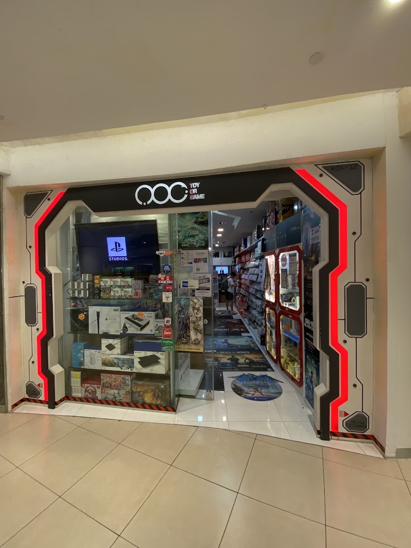 The futuristic storefront of 'Toy Or Game' showcasing gaming consoles, accessories, and merchandise.