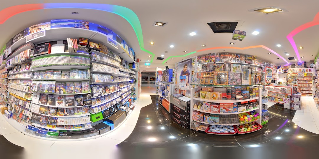 A vibrant interior view of a 'Toy Or Game' shop, showcasing shelves packed with video games, toys, and collectibles.