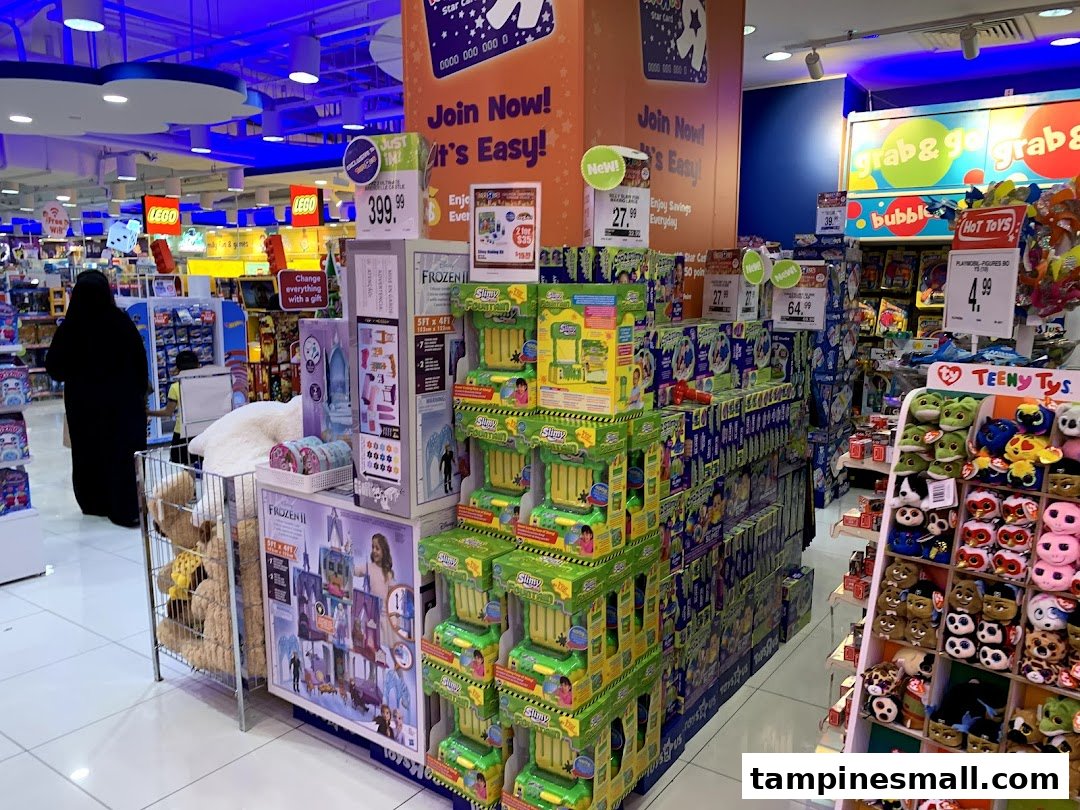 An interior view of ToysRUs Tampines Mall, showcasing diverse toy displays and promotions.