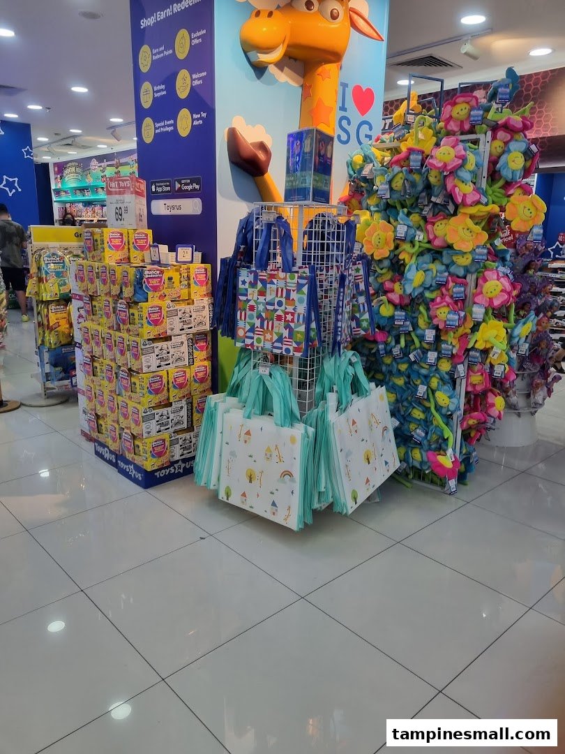 Vibrant interior of ToysRUs featuring colorful plush toys, reusable bags, and various toy displays.