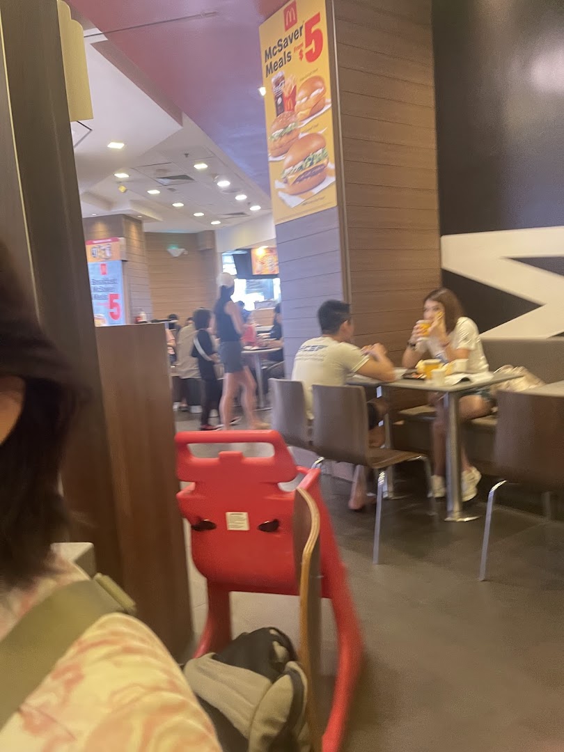 A bustling mall food court scene with diners enjoying meals, offering convenient dining options.
