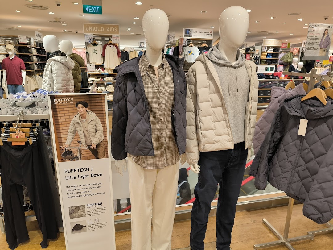 Mannequins display UNIQLO's PUFFTECH Ultra Light Down jackets, showcasing innovative lightweight outerwear in-store.