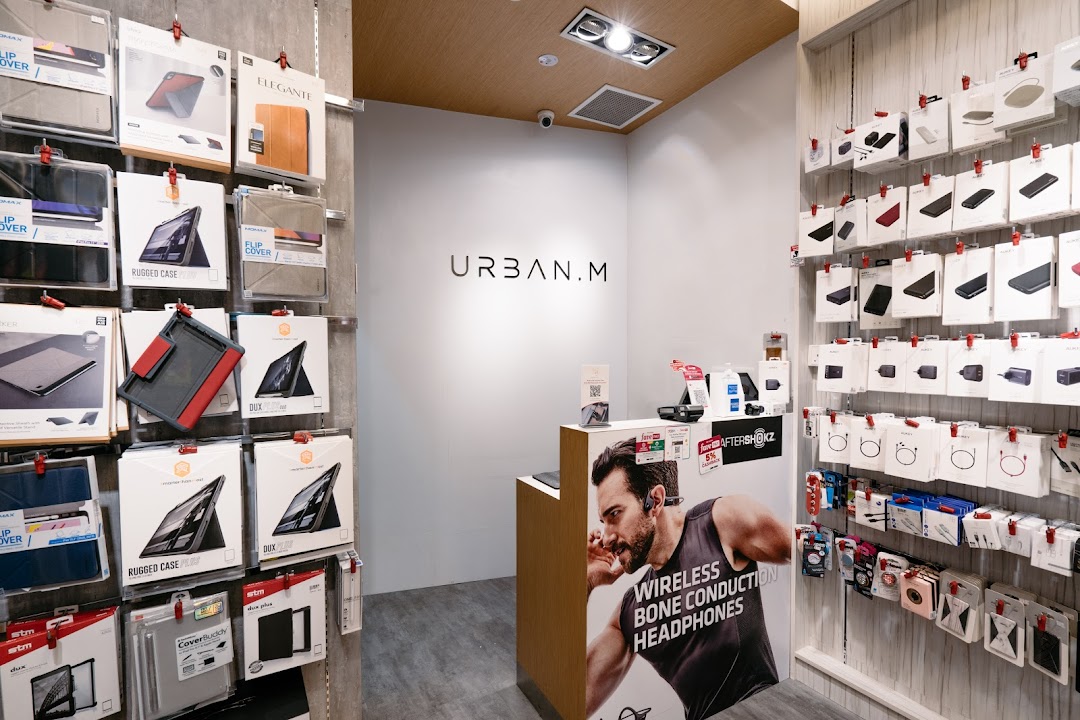 Interior view of URBAN.M, showcasing a wide range of mobile and tablet accessories, and audio devices.