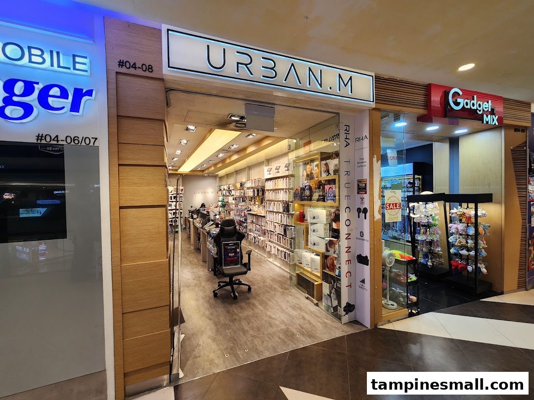 The storefront of URBAN.M, a modern electronics and gadget accessories shop, with its interior visible.