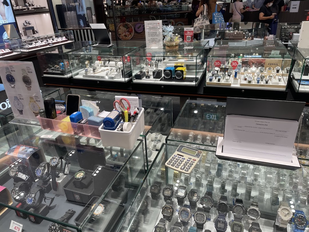 Interior view of Vincent Watch, showcasing numerous display cases filled with a wide selection of watches.