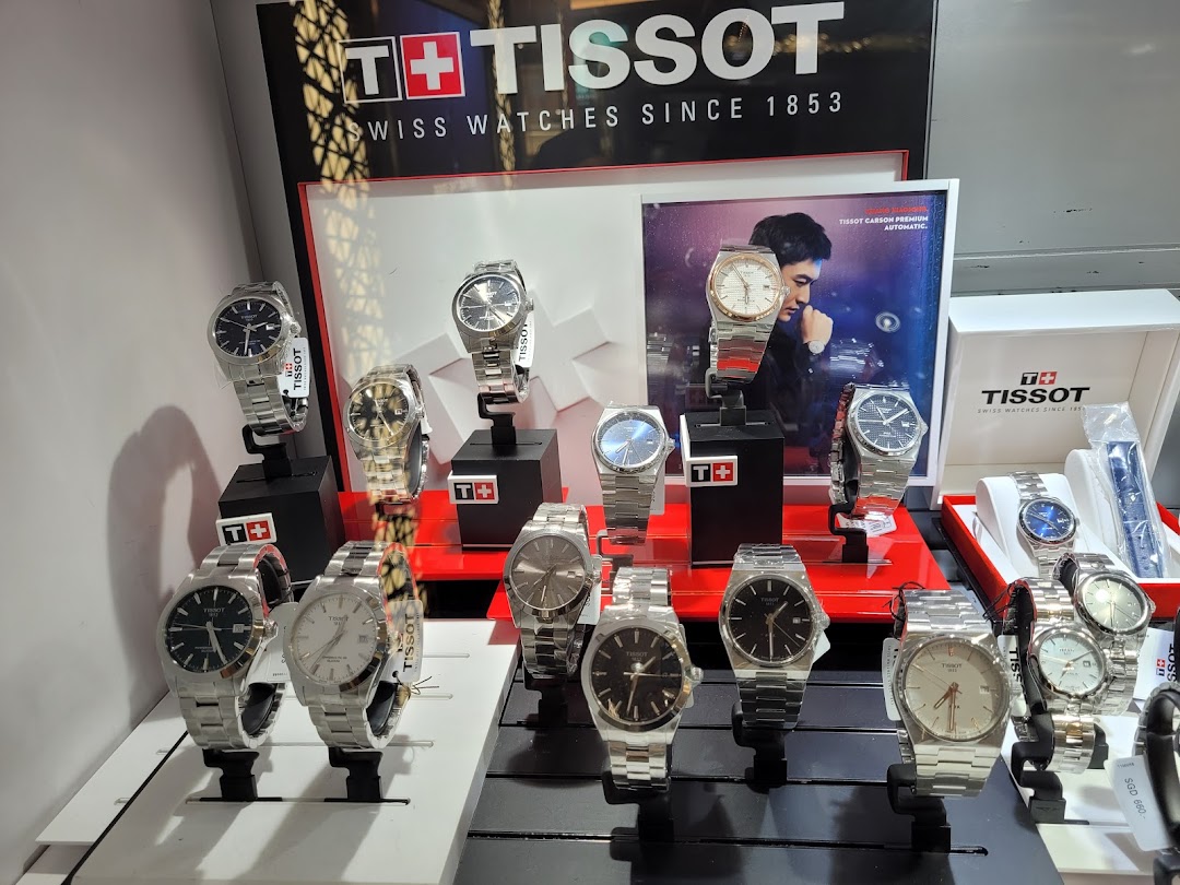 A vibrant display showcasing a variety of Tissot Swiss watches in a retail setting.