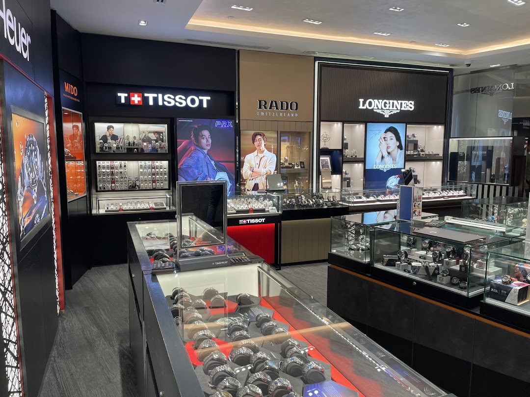 Interior view of Vincent Watch store showcasing luxury timepieces from brands like Tissot, Longines, and Rado.