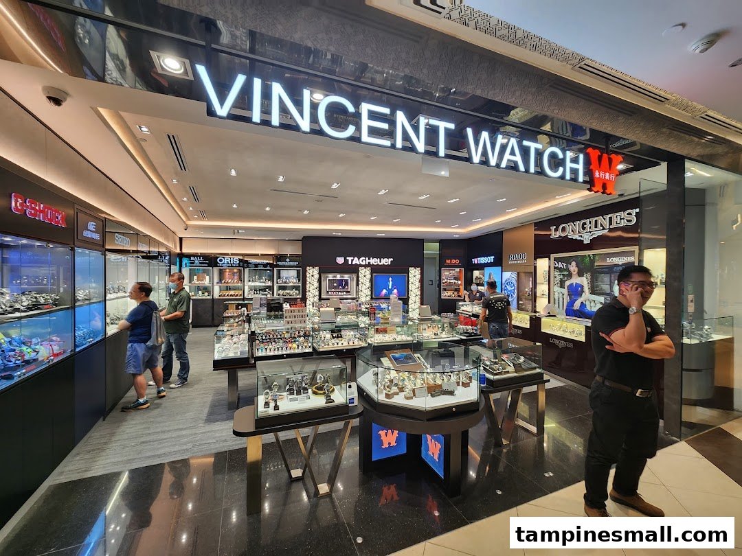 Interior view of Vincent Watch, a luxury watch retailer, showcasing various brands and customers browsing.