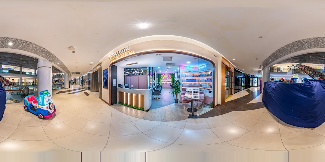 The inviting entrance of Vintage Studio VS Salon & Hairdressing, showcasing its modern interior within Tampines Mall.