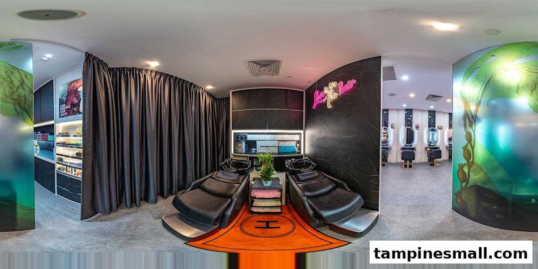 A panoramic interior view of a modern hair salon featuring wash basins and styling stations.