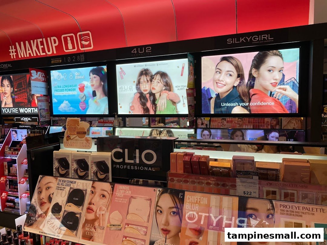 A vibrant display of makeup products and digital advertisements within a Watsons store.