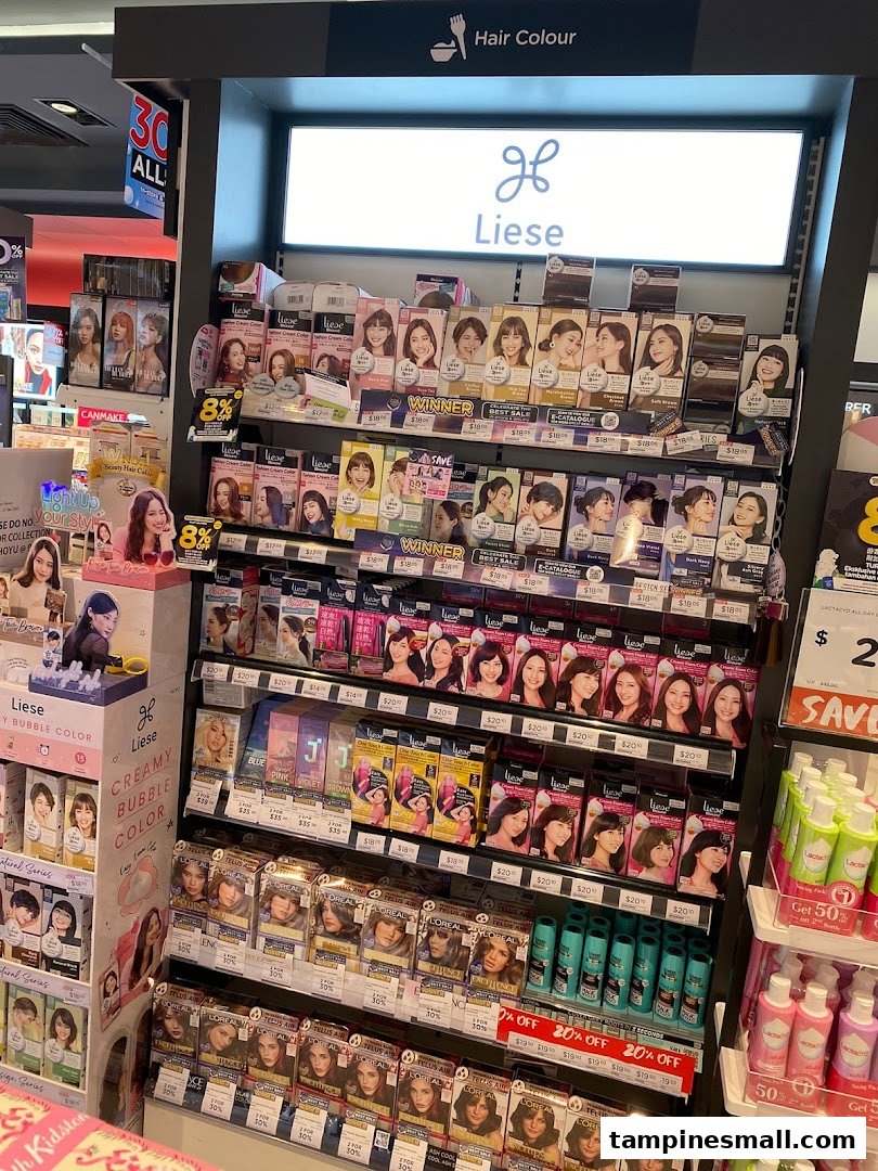 A vibrant display of hair color products, featuring Liese and L'Oreal, inside a Watsons store.