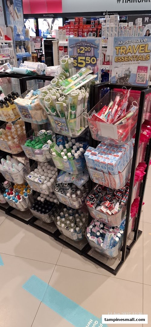 A retail display featuring various travel-sized personal care and hygiene products.